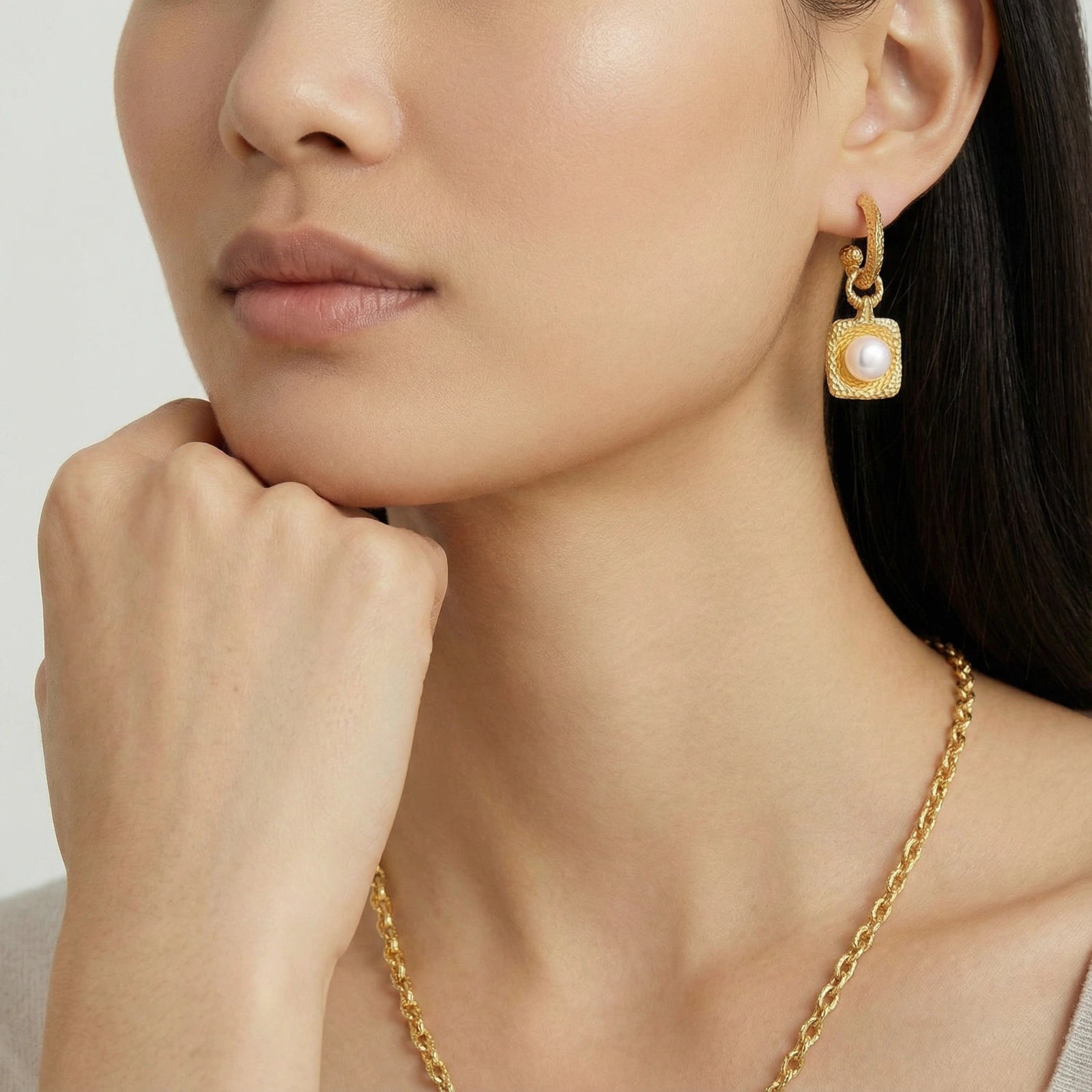 golden-pearl-drop-hoop-earrings-woman-wearing