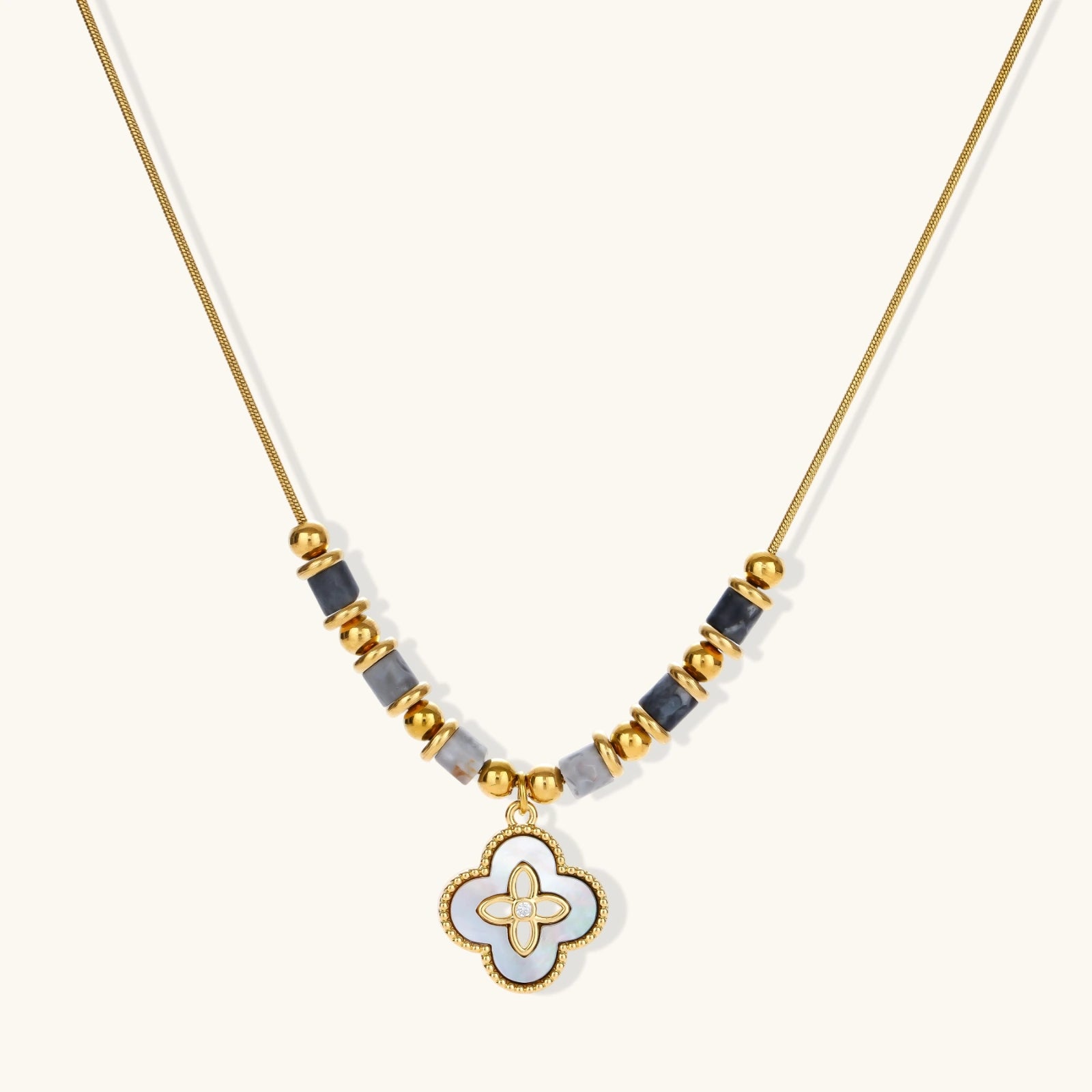 Abalone clover charm necklace in 18K gold plated stainless steel with iridescent quatrefoil pendant