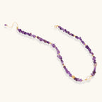 Close-up of gold vermeil medallion and freshwater pearl drop on amethyst beaded necklace by VAHN Jewels