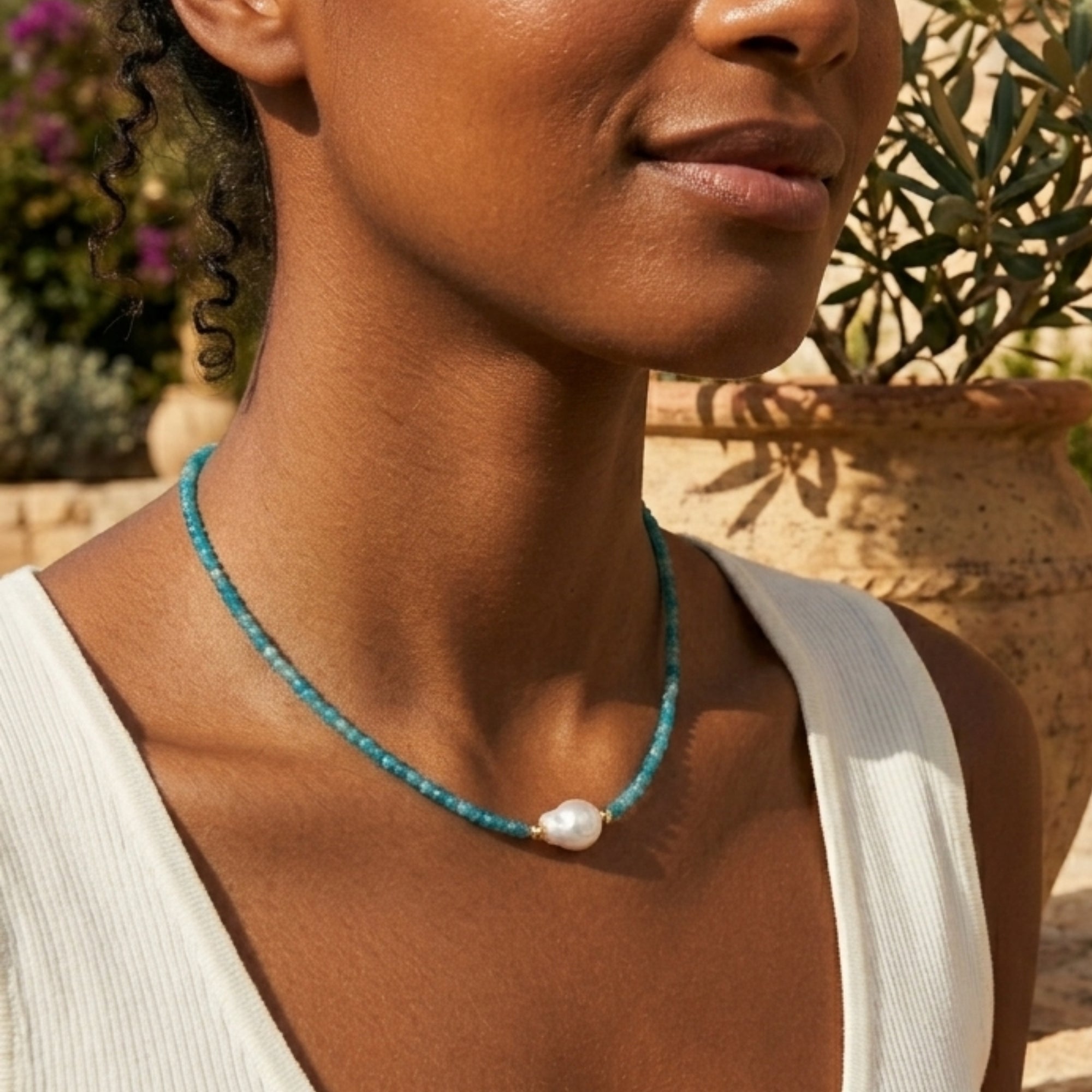 Woman wearing teal apatite pearl beaded necklace outdoors by VAHN Jewels
