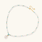 Flat lay of Aqua Bloom Edison pearl necklace with genuine turquoise and baroque Edison pearls