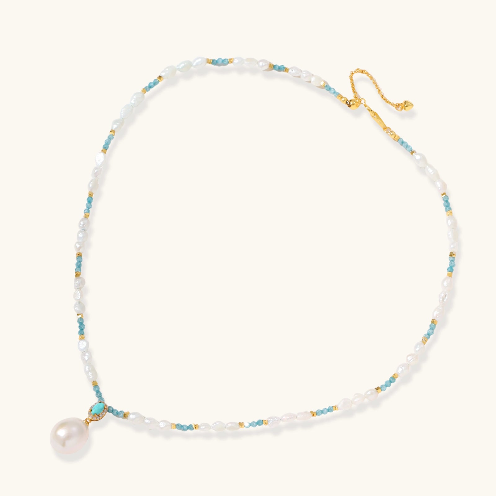 Flat lay of Aqua Bloom Edison pearl necklace with genuine turquoise and baroque Edison pearls