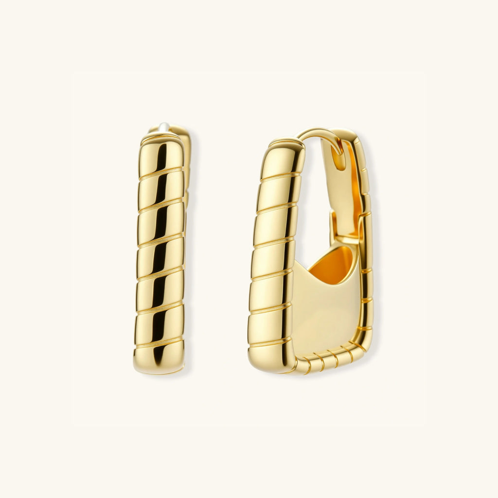 Close-up of segmented bamboo ridges on gold huggie hoop earrings, 925 sterling silver