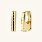 Close-up of segmented bamboo ridges on gold huggie hoop earrings, 925 sterling silver