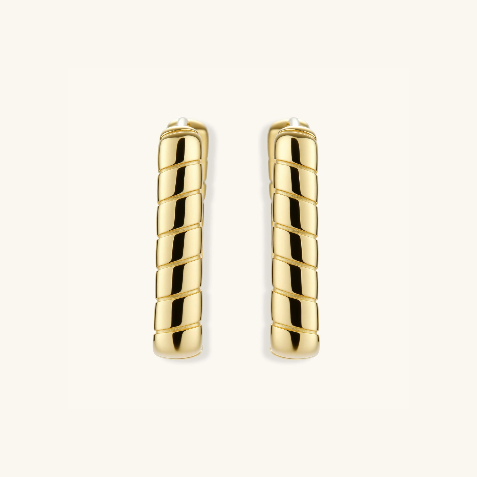 Side view of rectangular gold bamboo segment hoops in 18K gold-plated silver