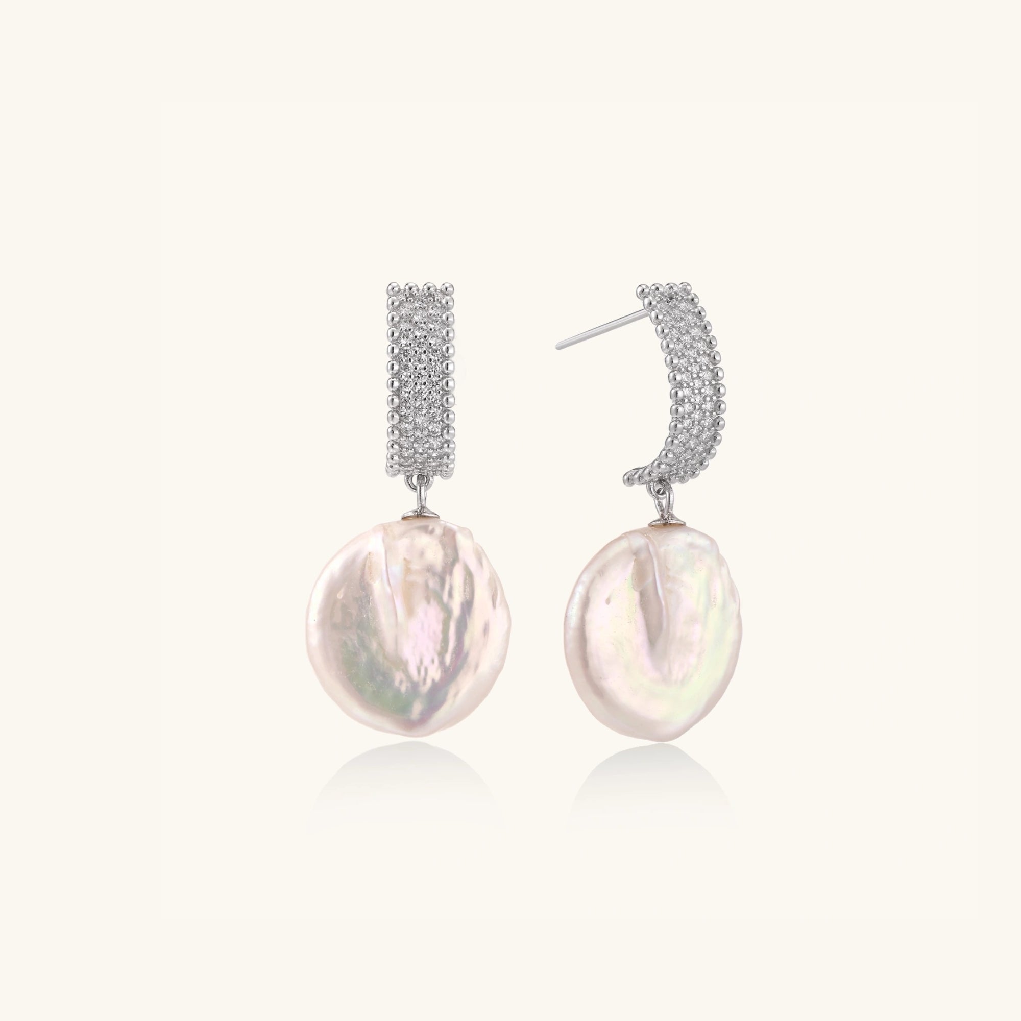 Close-up of baroque pearl drops with pave crystal in rhodium-plated silver