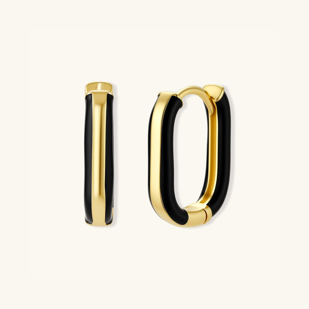 Overlapping pair of black enamel gold hoop earrings showing oval shape and enamel detail by VAHN Jewels