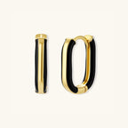 Overlapping pair of black enamel gold hoop earrings showing oval shape and enamel detail by VAHN Jewels