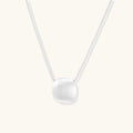 Brushed silver sphere necklace in 925 sterling silver with sculptural orb pendant on double snake chain by VAHN Jewels