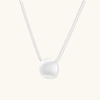 Brushed silver sphere necklace in 925 sterling silver with sculptural orb pendant on double snake chain by VAHN Jewels