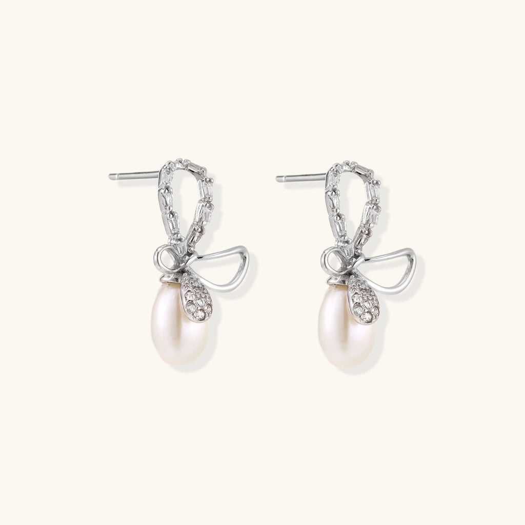 Pair of crystal bow pearl drop earrings with baguette crystals in 925 sterling silver