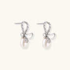 Pair of crystal bow pearl drop earrings with baguette crystals in 925 sterling silver