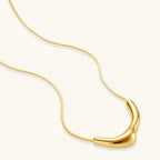 Full length view of 18K gold-plated 925 silver curve pendant necklace on fine snake chain by VAHN Jewels