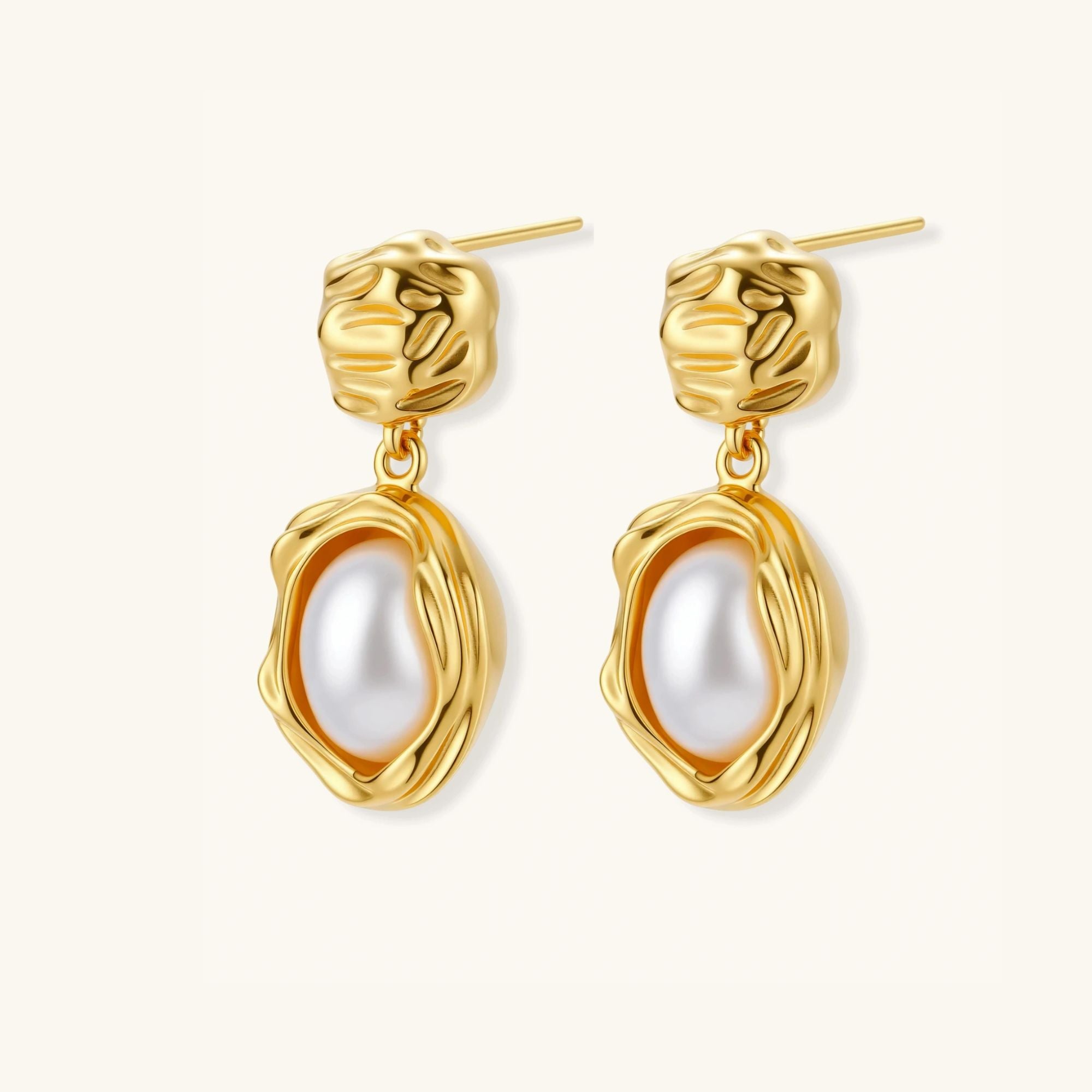 Angled view of golden bloom pearl drop earrings showing sculpted gold bloom setting and freshwater pearl by VAHN Jewels