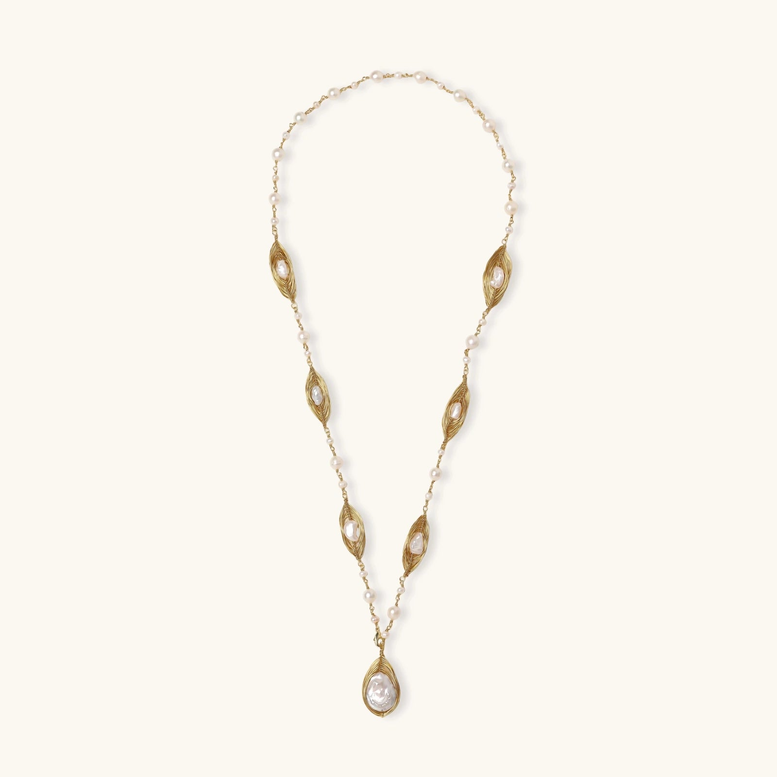 Golden cage baroque pearl sautoir in 14K gold plated eco-brass with freshwater baroque pearls in sculpted leaves