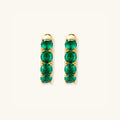 Green pave gold huggie hoop earrings in 18K gold-plated 925 sterling silver with emerald-green zirconia by VAHN Jewels