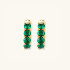 Green pave gold huggie hoop earrings in 18K gold-plated 925 sterling silver with emerald-green zirconia by VAHN Jewels