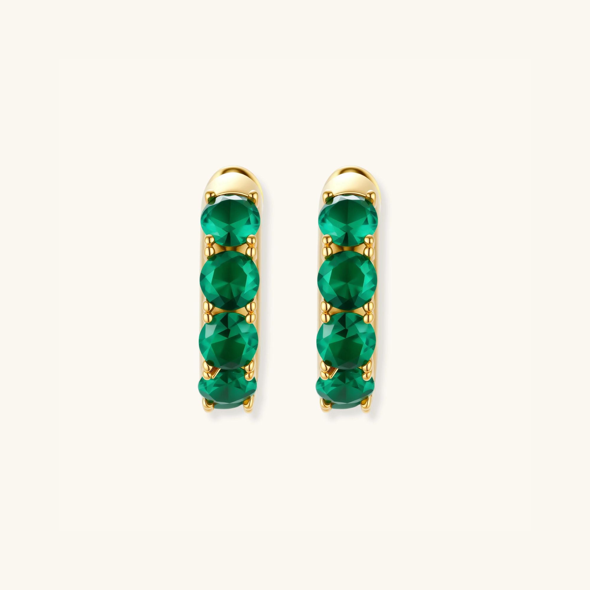Green pave gold huggie hoop earrings in 18K gold-plated 925 sterling silver with emerald-green zirconia by VAHN Jewels