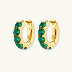 Close-up pair of green pave gold huggie hoop earrings in 18K gold-plated 925 silver by VAHN Jewels