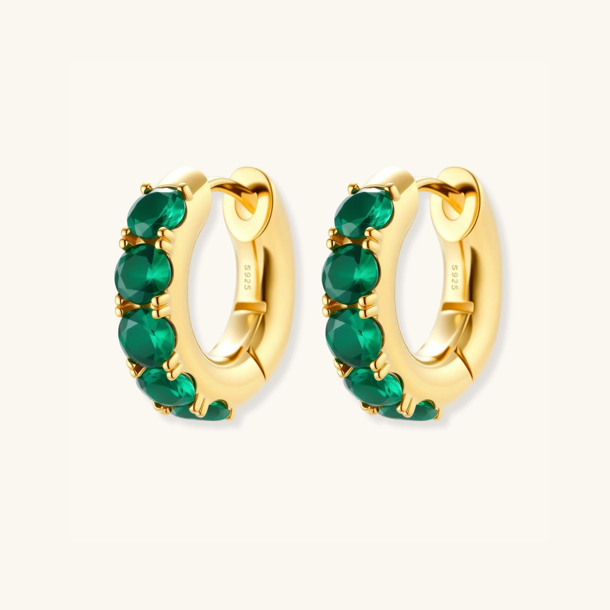 Close-up pair of green pave gold huggie hoop earrings in 18K gold-plated 925 silver by VAHN Jewels