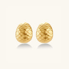 Hammered gold huggie earrings in 18K gold-plated 925 sterling silver with sculptural hammered texture by VAHN Jewels