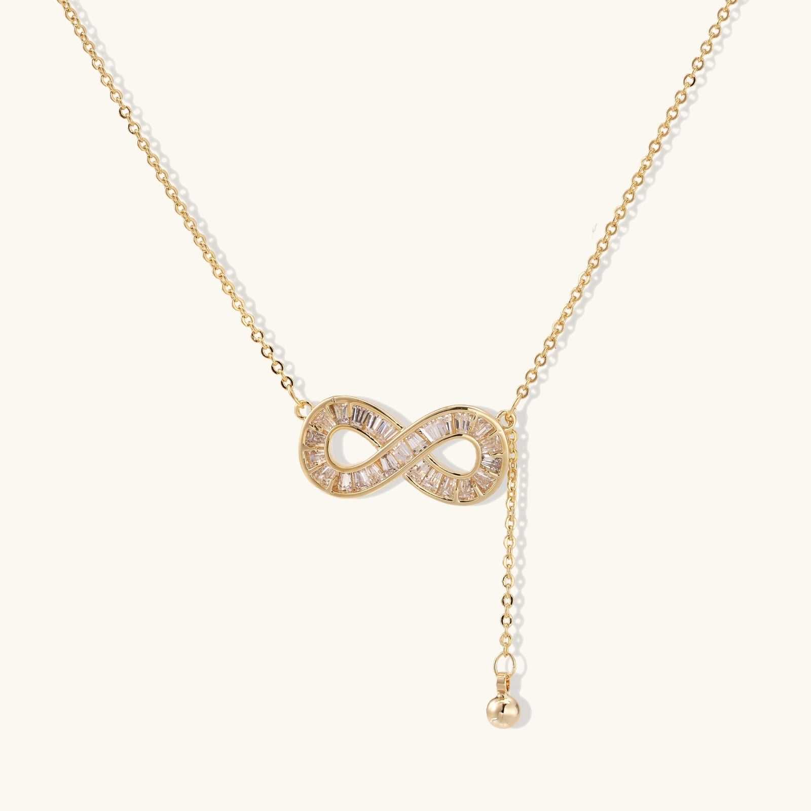 Infinity crystal necklace in 14K gold plated eco brass with baguette crystals