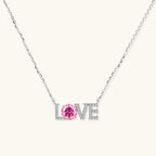 LOVE moissanite pendant necklace in 925 sterling silver with 1ct VVS1 pink moissanite center stone and pave letter setting by VAHN Jewels