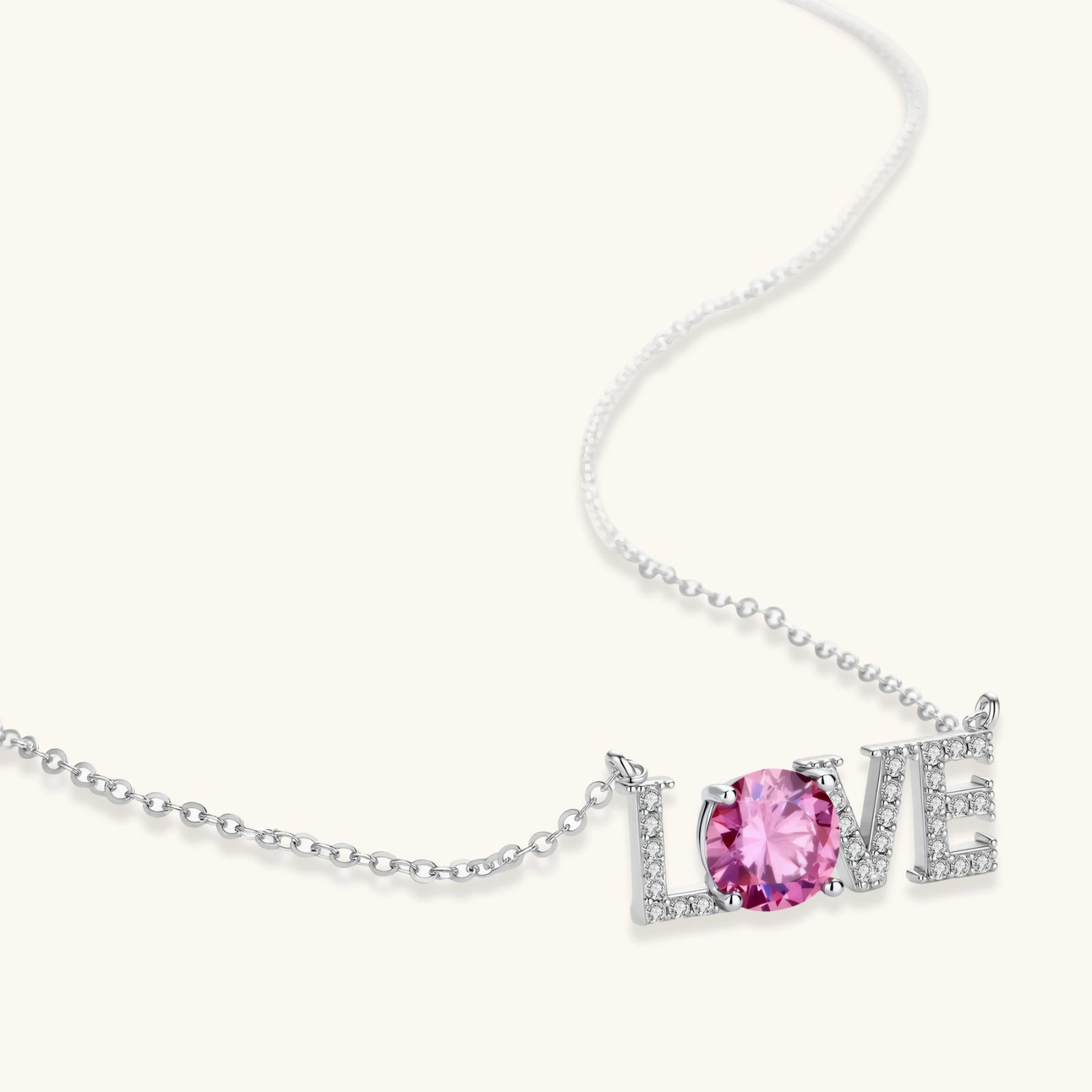 Full length view of LOVE moissanite pendant necklace on fine 925 silver cable chain by VAHN Jewels