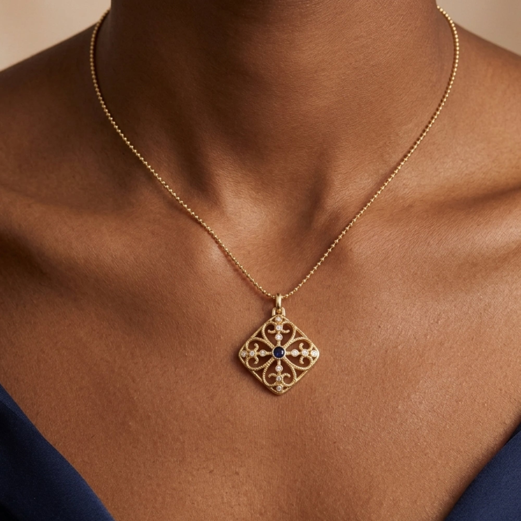 Woman wearing lapis lazuli filigree pendant necklace in 18K gold plated eco brass VAHN Jewels