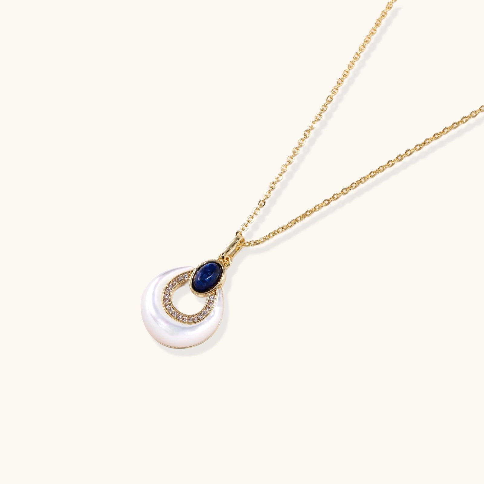 Close up of lapis lazuli teardrop pendant with mother of pearl and 18K gold VAHN Jewels