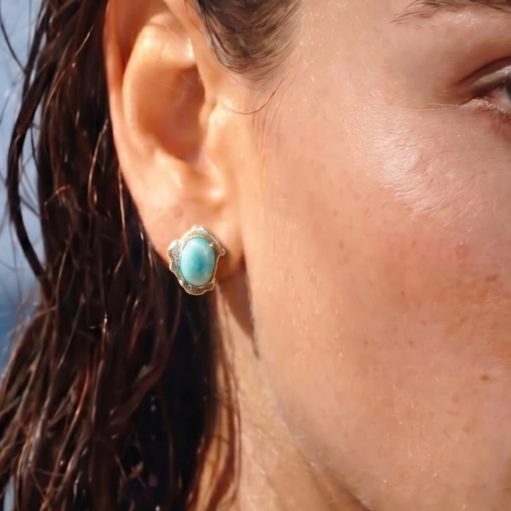 Woman wearing larimar cabochon stud earrings in silver | VAHN Jewels