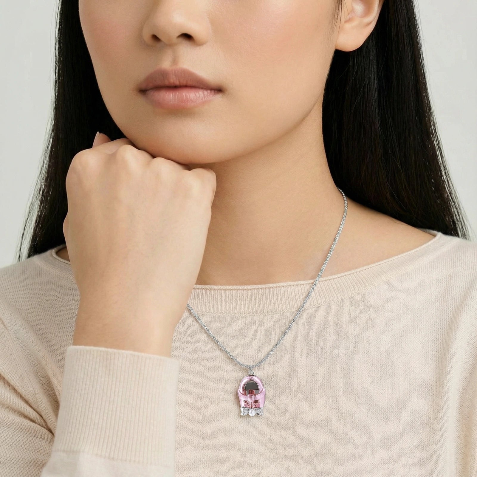 Woman wearing Mary Jane shoe charm necklace in white gold plated eco-brass by VAHN Jewels