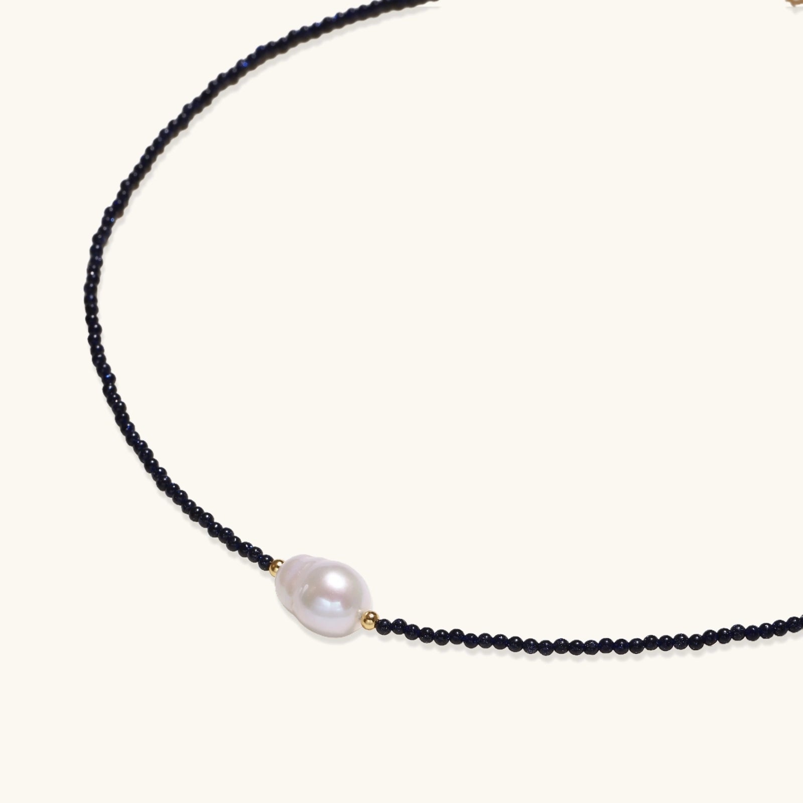Half circle view of blue sandstone and baroque pearl beaded necklace with gold vermeil accents by VAHN Jewels