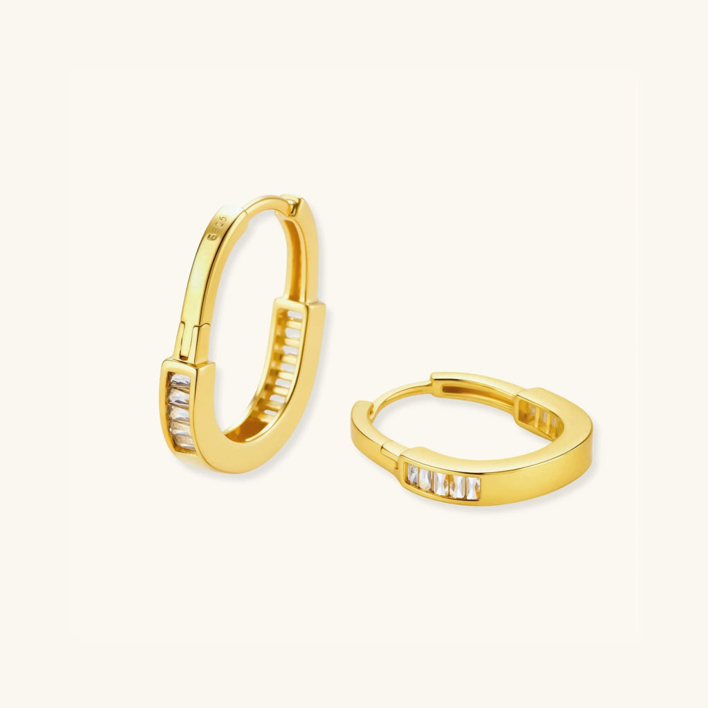 Angled pair view of pave gold huggie hoop earrings showing geometric arc and crystal setting by VAHN Jewels