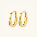 Pave gold huggie hoop earrings in 14K gold-plated 925 sterling silver with cubic zirconia along the arc by VAHN Jewels
