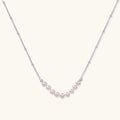 Pearl arc silver necklace in rhodium-plated 925 sterling silver with nine freshwater pearls in a crescent by VAHN Jewels