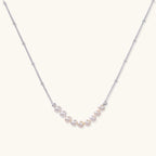 Pearl arc silver necklace in rhodium-plated 925 sterling silver with nine freshwater pearls in a crescent by VAHN Jewels