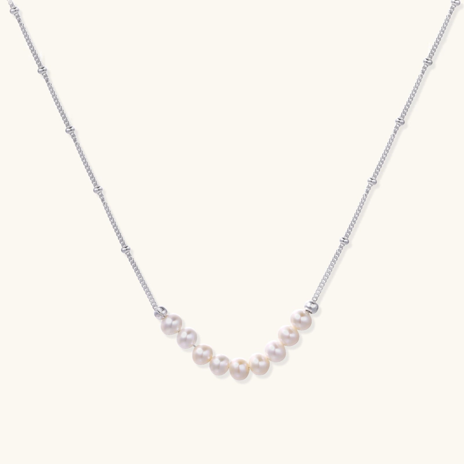 Pearl arc silver necklace in rhodium-plated 925 sterling silver with nine freshwater pearls in a crescent by VAHN Jewels
