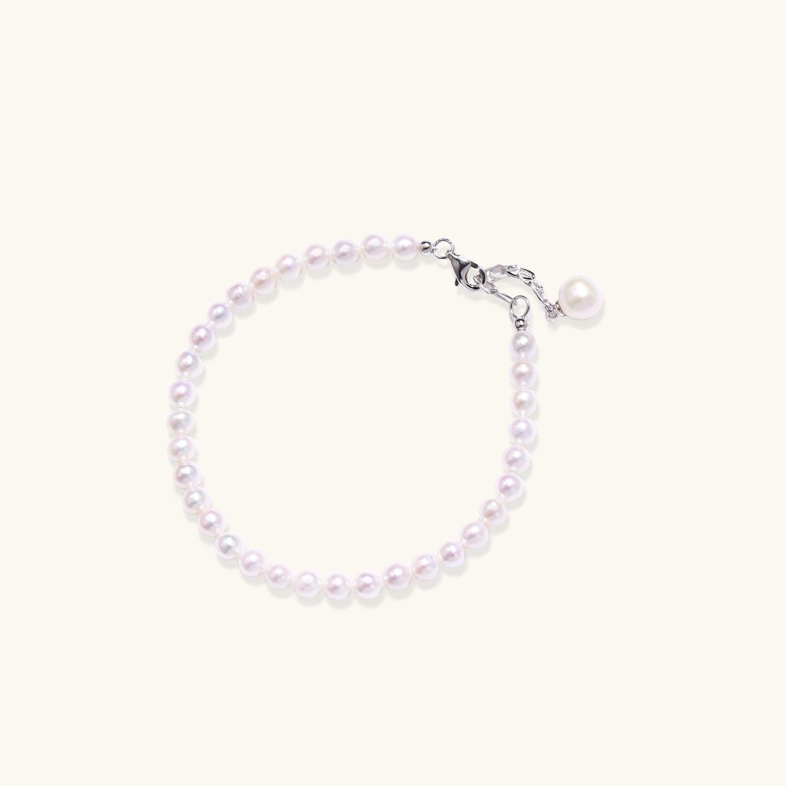Pearl beaded bracelet with freshwater pearls and pearl charm in rhodium-plated 925 sterling silver, front view | VAHN Jewels
