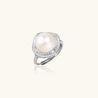 Side view of freshwater pearl cocktail ring with crystal halo in rhodium-plated silver