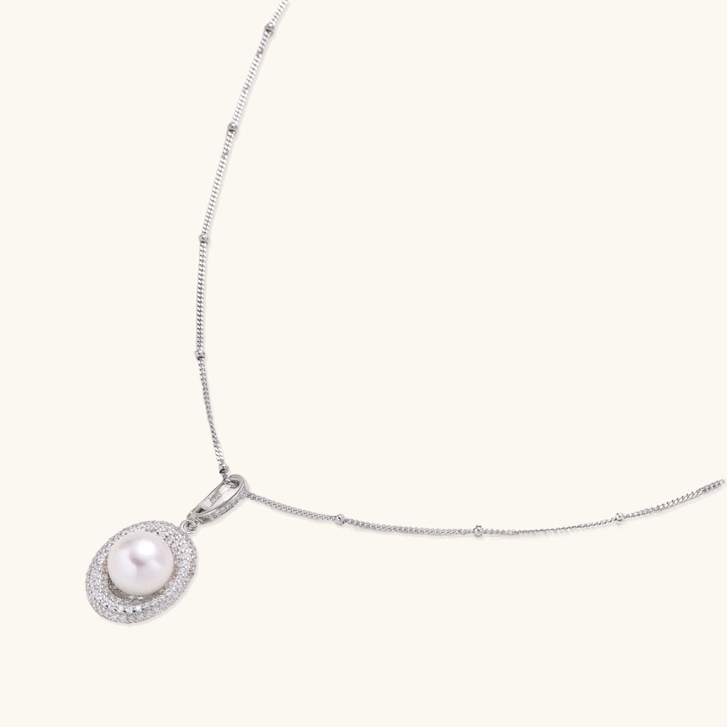 Full length view of pearl halo pendant necklace on rhodium-plated 925 silver satellite chain by VAHN Jewels