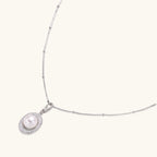 Full length view of pearl halo pendant necklace on rhodium-plated 925 silver satellite chain by VAHN Jewels