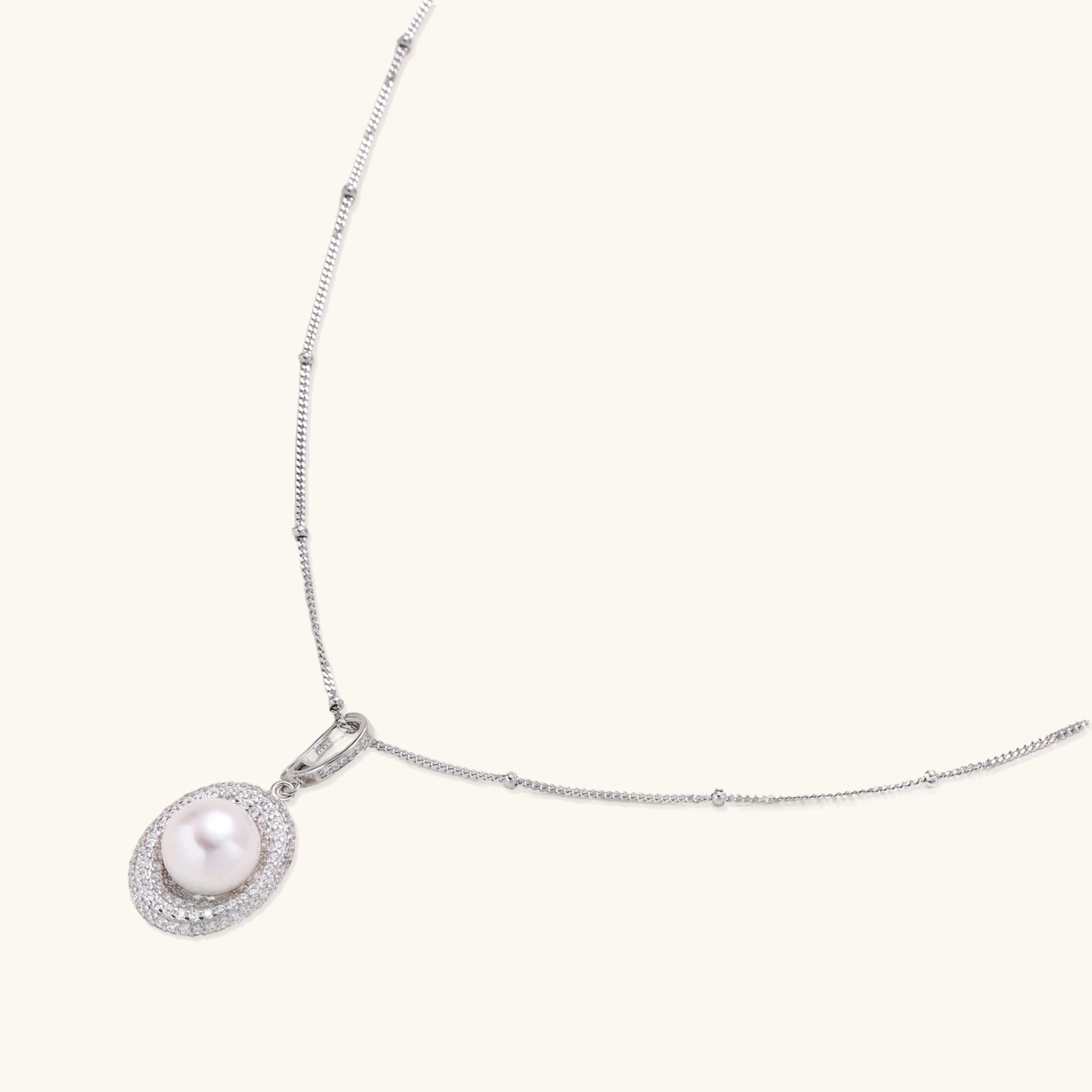 Full length view of pearl halo pendant necklace on rhodium-plated 925 silver satellite chain by VAHN Jewels