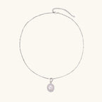 Flat lay of pearl halo silver necklace in rhodium plated sterling silver 925 with satellite chain