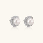 Angled view of pearl halo stud earrings showing cushion square halo and pearl depth by VAHN Jewels