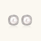 Pearl halo stud earrings in rhodium-plated 925 sterling silver with freshwater pearl and double pave zirconia cushion halo by VAHN Jewels