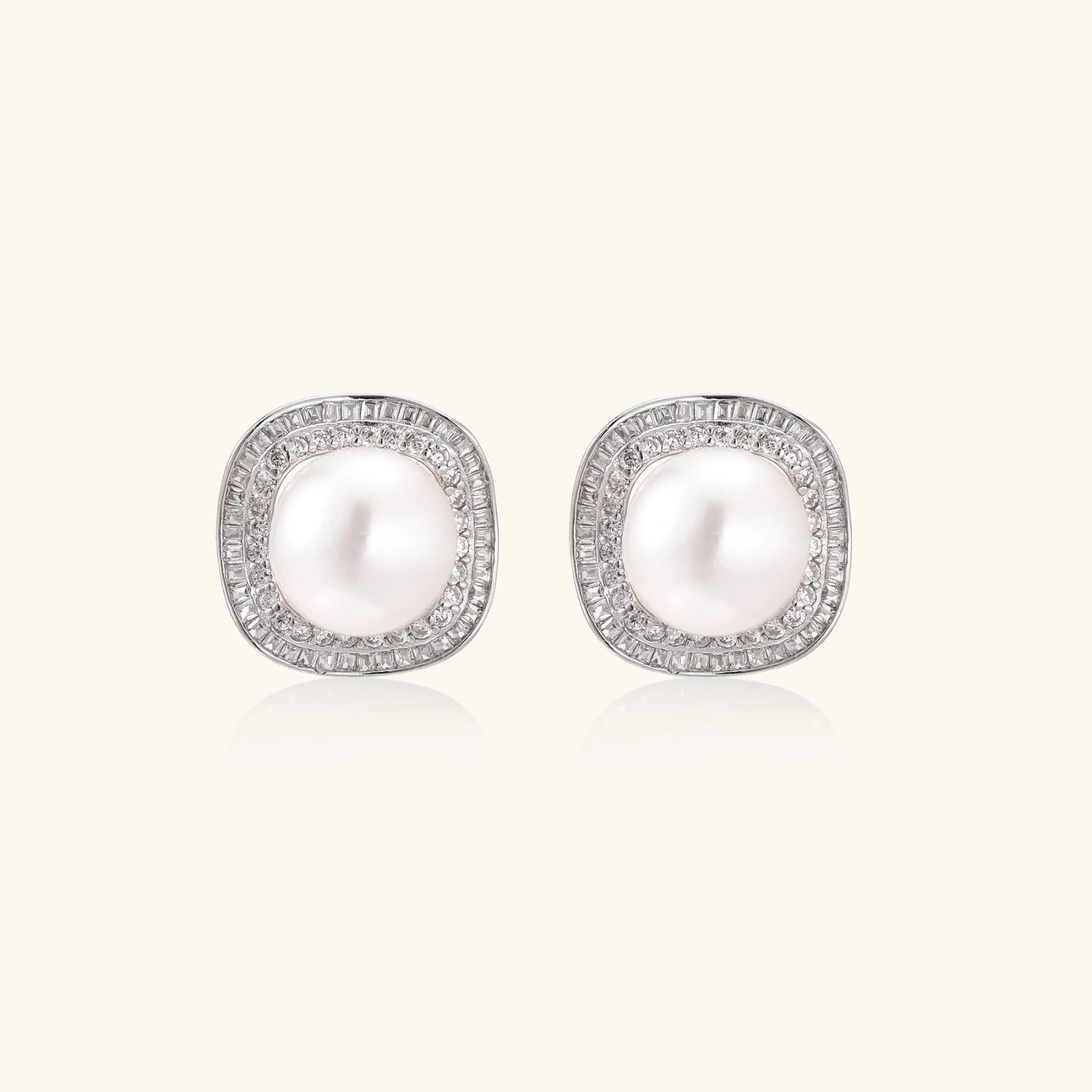 Pearl halo stud earrings in rhodium-plated 925 sterling silver with freshwater pearl and double pave zirconia cushion halo by VAHN Jewels