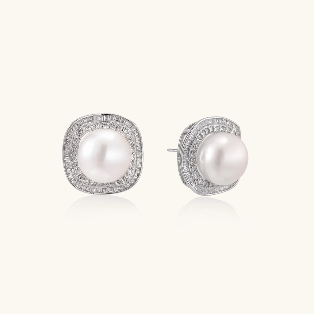 Close-up pair of pearl halo stud earrings showing double pave halo and freshwater pearl center by VAHN Jewels