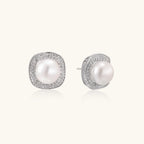 Close-up pair of pearl halo stud earrings showing double pave halo and freshwater pearl center by VAHN Jewels