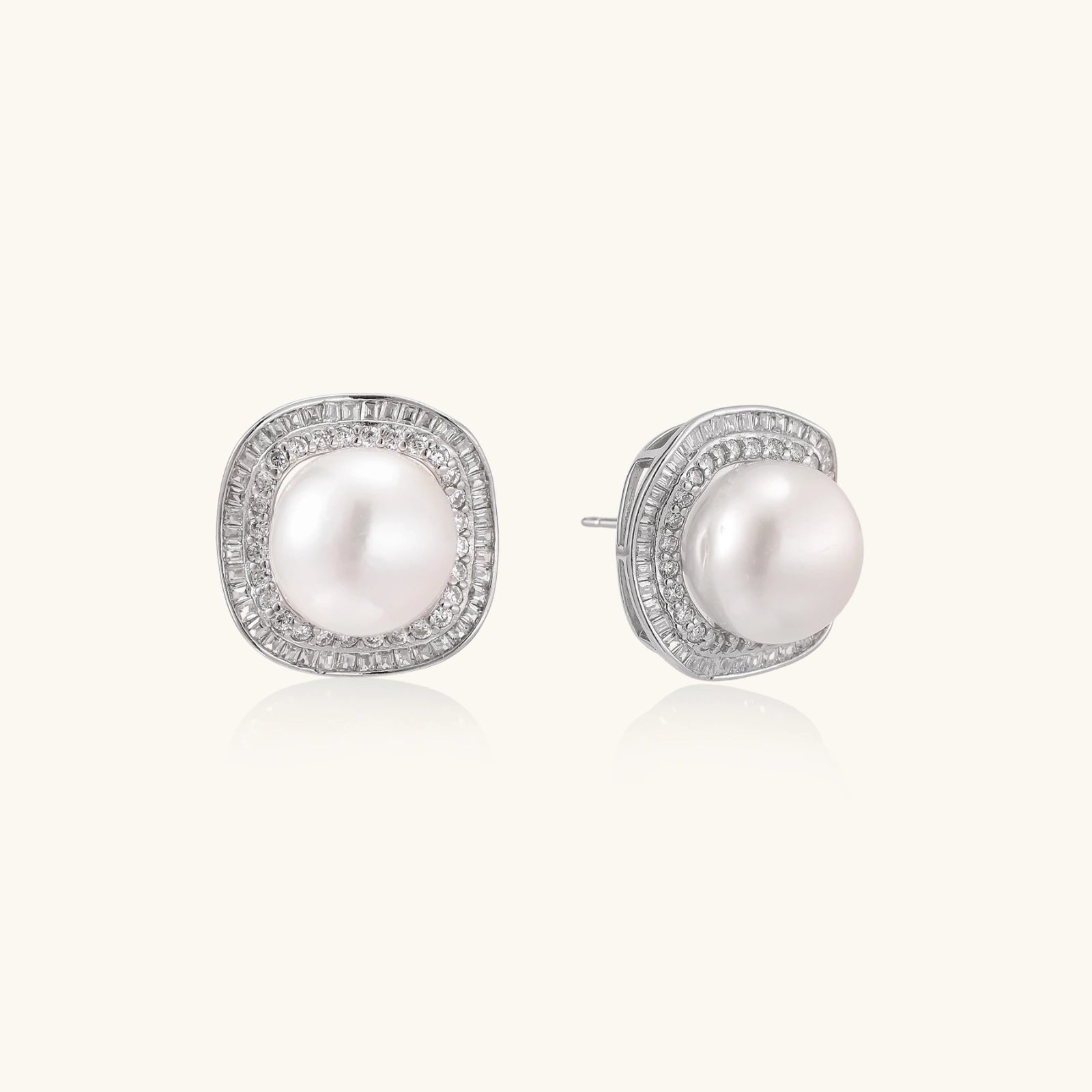 Close-up pair of pearl halo stud earrings showing double pave halo and freshwater pearl center by VAHN Jewels